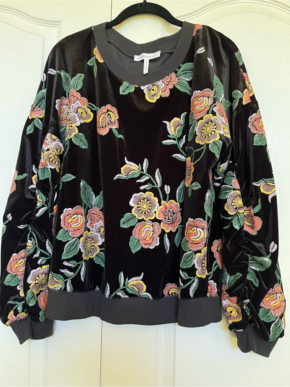 BCBGeneration Black Velvet Sweatshirt with Colorful Floral Embroidery